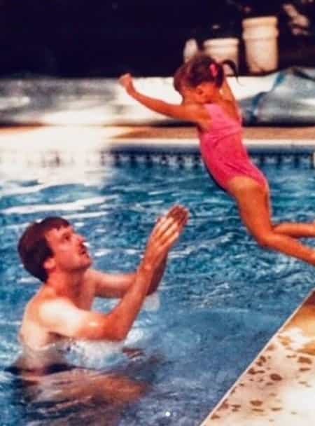 Lisa with her father during her childhood days at the Swimming pool
